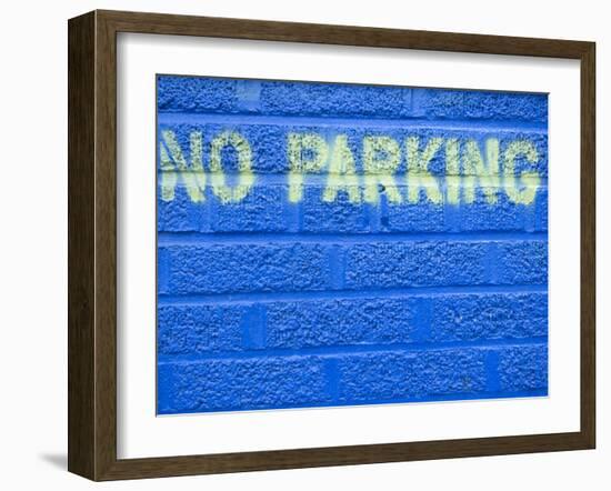 Painted Blue Brick Wall with No Parking Sign-John Nordell-Framed Photographic Print