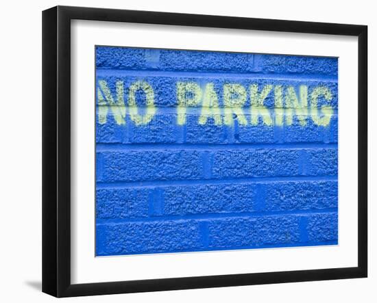 Painted Blue Brick Wall with No Parking Sign-John Nordell-Framed Photographic Print