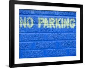 Painted Blue Brick Wall with No Parking Sign-John Nordell-Framed Photographic Print