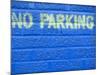 Painted Blue Brick Wall with No Parking Sign-John Nordell-Mounted Photographic Print