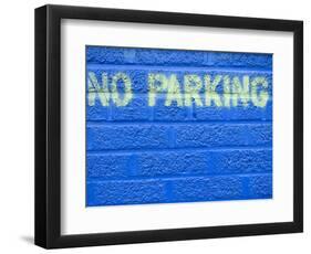 Painted Blue Brick Wall with No Parking Sign-John Nordell-Framed Photographic Print