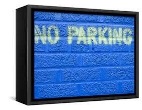 Painted Blue Brick Wall with No Parking Sign-John Nordell-Framed Stretched Canvas