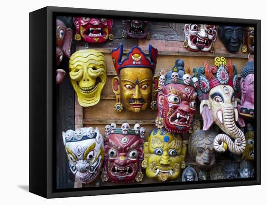 Painted face masks on display in the historical Newar city of Bhaktapur, Nepal, Asia-Alex Treadway-Framed Stretched Canvas