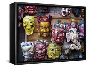 Painted face masks on display in the historical Newar city of Bhaktapur, Nepal, Asia-Alex Treadway-Framed Stretched Canvas