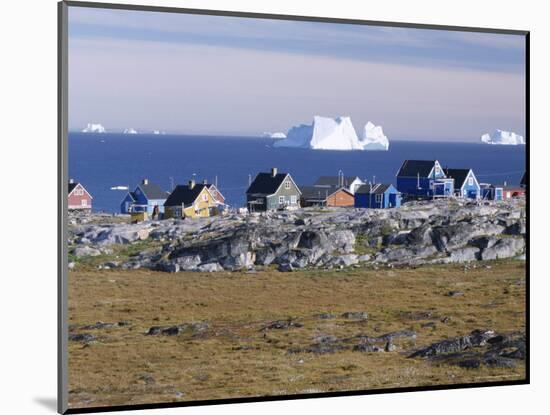 Painted Village Houses in Front of Icebergs in Disko Bay, West Coast, Greenland-Anthony Waltham-Mounted Photographic Print