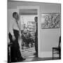 Painter Jackson Pollock Standing in Doorway Near One of His Paintings-Martha Holmes-Mounted Premium Photographic Print