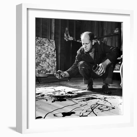 Painter Jackson Pollock Working in His Studio, Cigarette in Mouth, Dropping Paint Onto Canvas-Martha Holmes-Framed Photographic Print