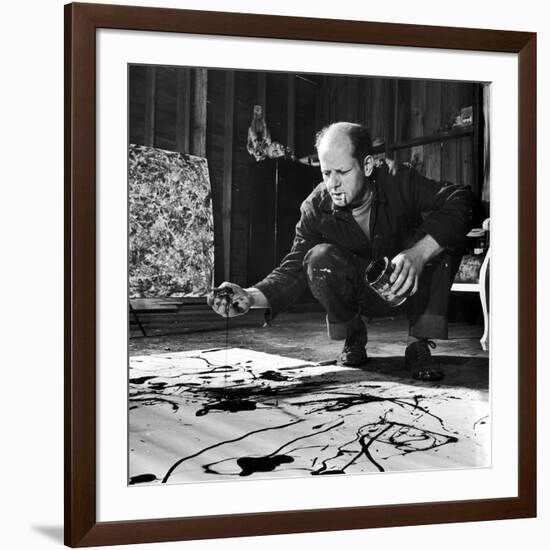 Painter Jackson Pollock Working in His Studio, Cigarette in Mouth, Dropping Paint Onto Canvas-Martha Holmes-Framed Photographic Print