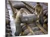 Pair of American Servicemen Moving a Large Bomb at an Ammunition Dump During WWII-null-Mounted Photographic Print