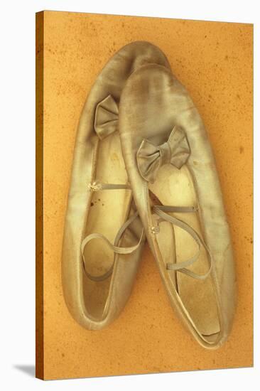 Pair of Ballet or Dancing Shoes Once White But Now Used and Grubby Sitting One Face Down-Den Reader-Stretched Canvas