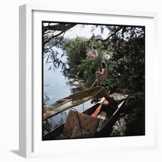 Pair of Nude Women Sitting Along the River Bank of the Thames-William Sumits-Framed Photographic Print