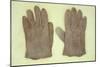 Pair of Pale Brown Cotton Victorian Childs Gloves Lying on Antique Paper-Den Reader-Mounted Photographic Print