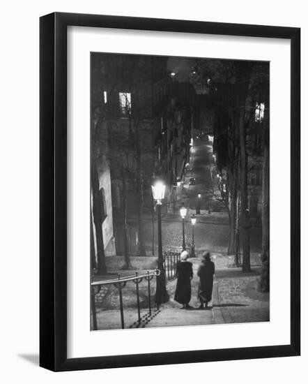 Pair of Prostitutes Descending Stairs after Dark in Montmartre-Alfred Eisenstaedt-Framed Photographic Print