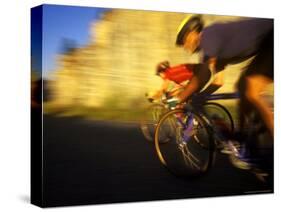 Pair of Road Cyclists Speed Downhill-Chuck Haney-Stretched Canvas