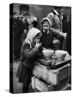 Pair of Russian Children Having a Meal of Molasses Bread and Coffee in a Displaced Persons Camp-null-Stretched Canvas