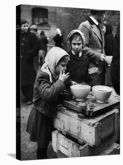 Pair of Russian Children Having a Meal of Molasses Bread and Coffee in a Displaced Persons Camp-null-Stretched Canvas