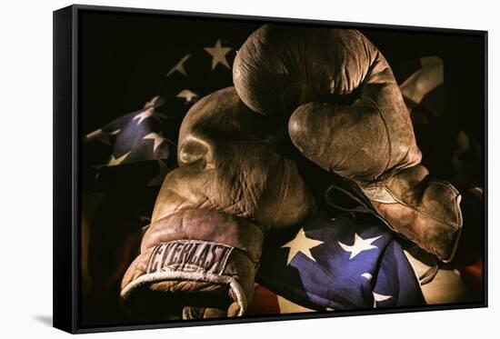 Pair of vintage boxing gloves laying on a flag carefully painted with light-Sheila Haddad-Framed Stretched Canvas