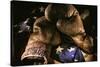 Pair of vintage boxing gloves laying on a flag carefully painted with light-Sheila Haddad-Stretched Canvas