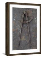 Pair of Vintage Tarnished Measuring Dividers Or Compasses Lying On Rusty Metal Sheet-Den Reader-Framed Photographic Print