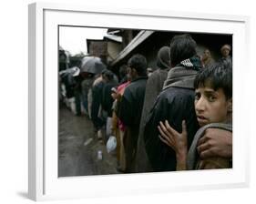 Pakistanis Wait in Line to Receive Food as Aid-null-Framed Photographic Print