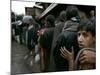 Pakistanis Wait in Line to Receive Food as Aid-null-Mounted Photographic Print