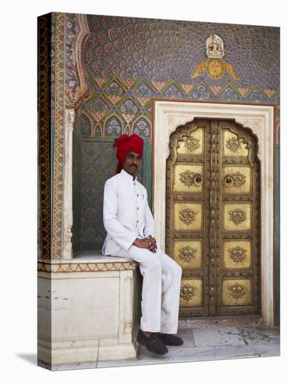 Palace Guard Sitting at Rose Gate in Pitam Niwas Chowk, City Palace, Jaipur, Rajasthan, India, Asia-Ian Trower-Stretched Canvas