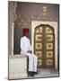 Palace Guard Sitting at Rose Gate in Pitam Niwas Chowk, City Palace, Jaipur, Rajasthan, India, Asia-Ian Trower-Mounted Photographic Print