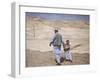 Palestinian Father and Son Walk in Desert During Celebrations Marking the Annual Day of Nebi Musa-null-Framed Photographic Print