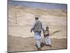 Palestinian Father and Son Walk in Desert During Celebrations Marking the Annual Day of Nebi Musa-null-Mounted Photographic Print