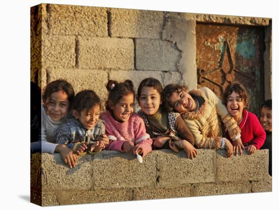 Palestinian Girls Giggle While Photographed Where Shell from an Israeli Gunboat Landed Earlier-null-Stretched Canvas