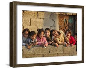 Palestinian Girls Giggle While Photographed Where Shell from an Israeli Gunboat Landed Earlier-null-Framed Photographic Print