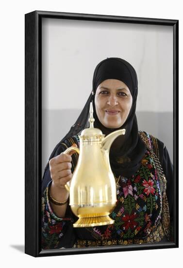 Palestinian volunteer offering coffee at the Physicians for Human Rights' mobile clinic-Godong-Framed Photographic Print