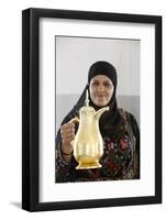 Palestinian volunteer offering coffee at the Physicians for Human Rights' mobile clinic-Godong-Framed Photographic Print