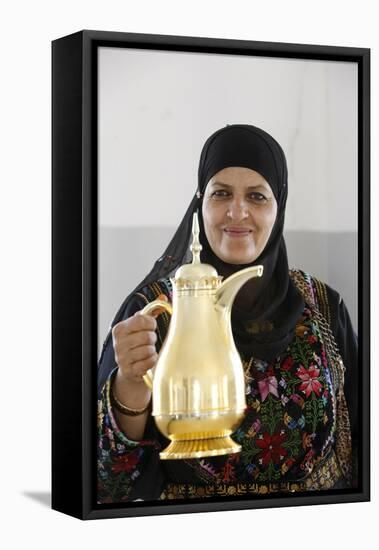 Palestinian volunteer offering coffee at the Physicians for Human Rights' mobile clinic-Godong-Framed Stretched Canvas