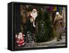 Palestinian Woman Walks Past Christmas Decorations at a Shop in Jerusalem's Old City-null-Framed Stretched Canvas