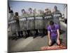 Palestinian Worshipper Prays Outside Jerusalem's Old City While Israeli Forces Stand Guard-null-Mounted Photographic Print