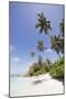 Palm trees lean over white sand, under a blue sky, on Bandos Island in The Maldives, Indian Ocean,-Stuart Forster-Mounted Photographic Print