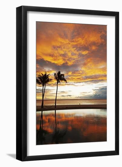 Palm trees silhouetted against red clouds during sunset over a beach at Flic en Flac-Stuart Forster-Framed Photographic Print