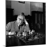 Palmiro Togliatti Thoughtful in Front of a Chessboard-Marisa Rastellini-Mounted Photographic Print