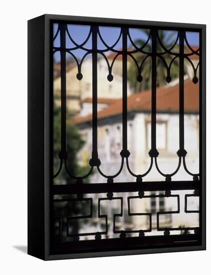 Palms and Red-roofed Buildings Through Iron Grillwork, Lisbon, Portugal-Merrill Images-Framed Stretched Canvas