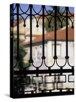 Palms and Red-roofed Buildings Through Iron Grillwork, Lisbon, Portugal-Merrill Images-Stretched Canvas