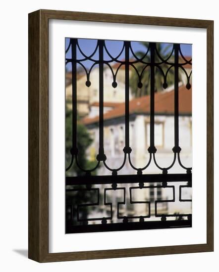 Palms and Red-roofed Buildings Through Iron Grillwork, Lisbon, Portugal-Merrill Images-Framed Photographic Print