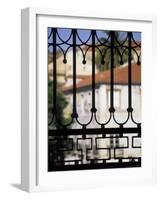 Palms and Red-roofed Buildings Through Iron Grillwork, Lisbon, Portugal-Merrill Images-Framed Photographic Print