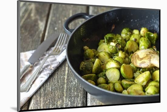 Pan-Fried Brussels Sprouts in Cast-Iron Frying Pan on Wooden Table-Jana Ihle-Mounted Photographic Print