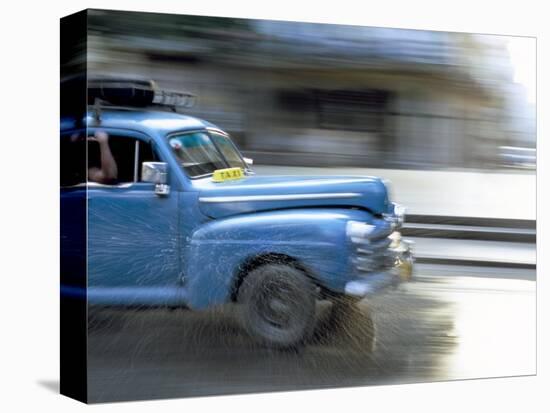 Panned Shot of Old American Car Splashing Through Puddle on Prado, Havana, Cuba, West Indies-Lee Frost-Stretched Canvas