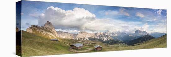 Panorama of green meadows and huts of the Odle mountain range seen from Seceda, Val Gardena, Trenti-Roberto Moiola-Stretched Canvas