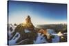 Panorama Seen from Sunset Through a Cairn on Pirchkogel with Snow, Summit Cross and Prayer Flags-Niki Haselwanter-Stretched Canvas