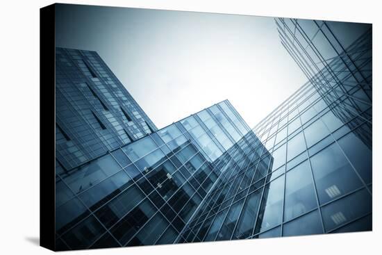 Panoramic and Perspective Wide Angle View to Steel Blue Background of Glass High Rise Building-Vladitto-Stretched Canvas