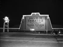 1940s MARQUEE SIGN FOR DRIVE-IN MOVIE THEATER LIT UP AT NIGHT-Panoramic Images-Photographic Print