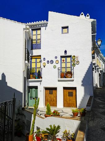 A street scene in the new part of the White Village of Frigiliana. Known as a "pueblo blanco" be...